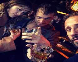 Joel Kinnaman consuming alcohol